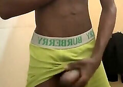 Sexy teen with abs stroking his big black cock in public