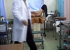 Hardcore fingering for a cute Jap during the pussy exam