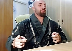 Extremely muscled man squeezes his junk