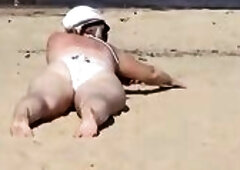 Nimble aged mamma has enjoyment with youthful lads on the beach two