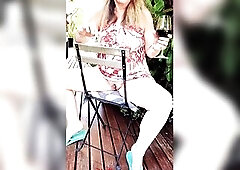 Sexually excited older outdoors sipping red wine in summer suit and no knickers, showing her large powerful twat .