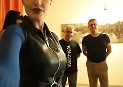 Hot dominatrixes in constricted leather and boots tower over avid pliant males lying on the floor, passionately trampling their bodies with intensive 