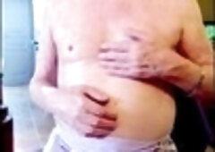 Diana acts all flirty while getting nude and giving herself a handjob