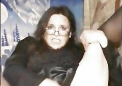 Ravishing brunette shemale with glasses plays with her throbbing cock