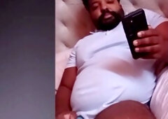 Bearded daddy bear indulges in playing with his thick black cock live