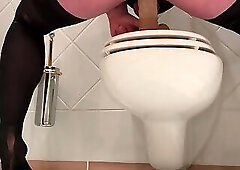 Beta Jessbell rides the dildo deep on the toilet wearing a chastity