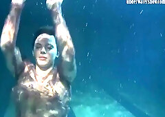 Dressed underwater beauty Bulava Lozhkova swims naked