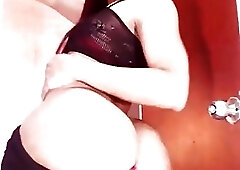 Redhead shemale teases with her big ass and hard dick