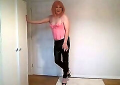 Strawberry blonde in pink basque and leather trousers
