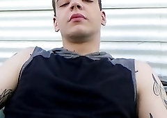 Tattooed jock plays with his boner while jerking off solo