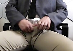 Asian dude doing some rotating edging in slick business clothes