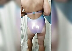 Transsexual wearing and jerking in shiny swimsuit