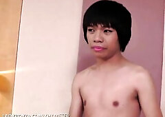 Short-haired ladyboy in ebony suit enjoys solo masturbation