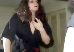 Classy brunette shemale puts on her makeup and sexy stockings