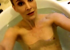 Busty amateur milf masturbates in the shower