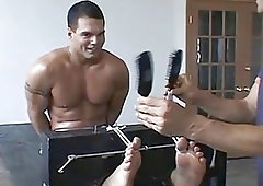 Muscular jock tied up for gay domination and erotic tickling