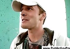 Gay public blowjob with a city view