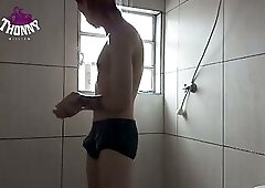 Well-endowed young man caught on hidden camera shaving in the shower