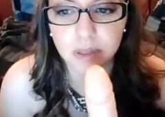 Nerdy Chick with glasses sucking dildo and masturbating on webcam live