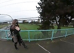 Crossdresser flashing on a highway bridge