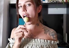 Tattooed brunette gives oral while holding a lollipop in POV shot