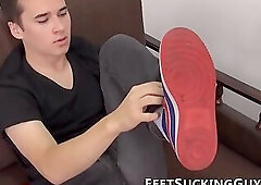 Perverted twink licks his feet and strokes his thick cock