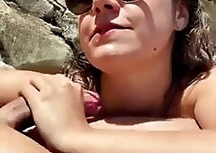 Sneaky blowjob on public beach