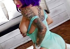 Comely TS Foxxy flaunts her bodacious body in a sheer swimsuit