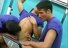 Trio suckers in blue T-shirts in gym