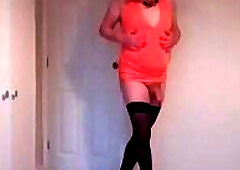 Stripping out of my orange minidress in black hold up stockings