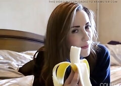 College gal Sophia Smith takes to lying on her couch in her full college uniform, teasing us with munching on a banana and giving us all a scarcely an