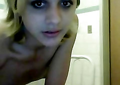 Adorable blonde shemale strips to masturbate in front of webcams