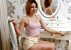 Redhead teen Lolly Bomb is touching her wet shaved pussy