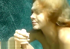 Fiery redhead girlfriend gives her boyfriend a deep underwater blowjob in the middle of the moonlit pool