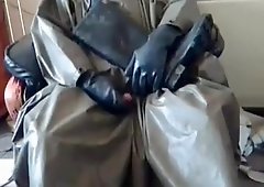 Wanking in tatty rubber poncho and even tattier rubber waders.