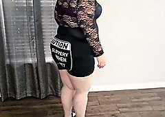 Pale plus-sized woman in black leather skirt spreads for bald dark-skinned man in the kitchen