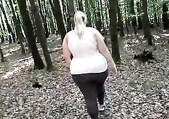 Large butt blond plumper is getting drilled from the back, in the nature, during the day