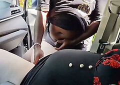Curvy woman in red headscarf urinates on car door while Arab man jerks off nearby
