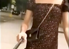 Super crazy asian shemale flashing her cock on the stre