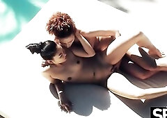 Beautiful lesbian babes flirt by the pool in advance of making every other climax