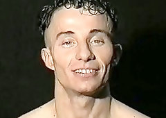 Muscled stud stripteases before jerking his rod