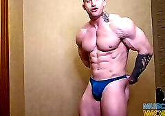 Massive Muscle God Flexes Hard Muscles Up Close