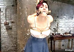 Slightly bent forward redhead big tits slave Iona Grace with hands tied behind her back gets hard whipped by master James Mogul then takes crotch rope