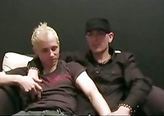 Blonde and brunet guys kissing