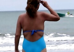 Stepmother shows off on the beach, that babe makes my weenie hard and takes me to satisfy me