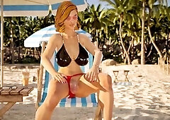 Redhead futa has her way with a platinum-blonde babe on the beach