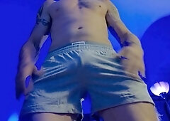 Inked muscle hunk with a buzz cut and a beard shows off his big cock and busts a nut