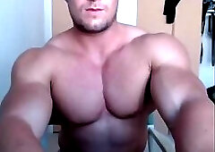 Muscle god poses and plays with his cock