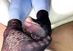 Slipping into my leopard nylon socks, I let the silky fabric glide over your skin—each wank teasing, each rub pure nylon bliss. This footjob is all 