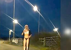 Cd golden-haired walking near busy road